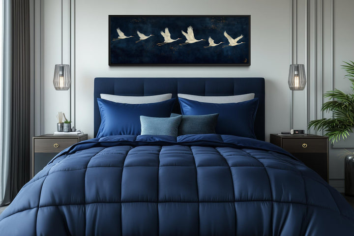 Panoramic navy blue canvas print featuring a horizontal procession of elegant flying white cranes.