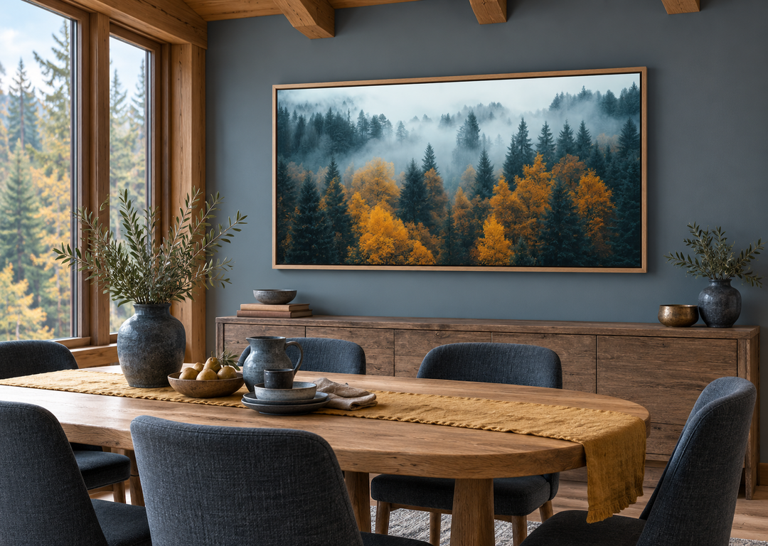 Moody Foggy Forest Framed Canvas Wall Art in a panoramic oak frame above a wooden sideboard.