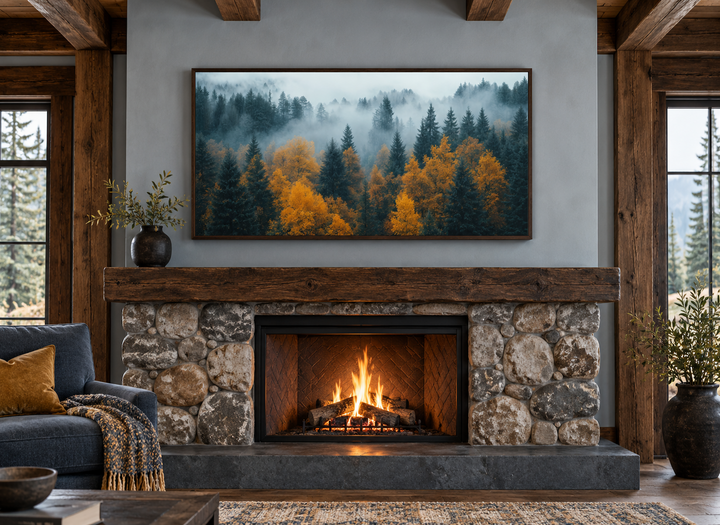 Moody Foggy Forest Framed Canvas Wall Art displayed above a rustic stone fireplace.