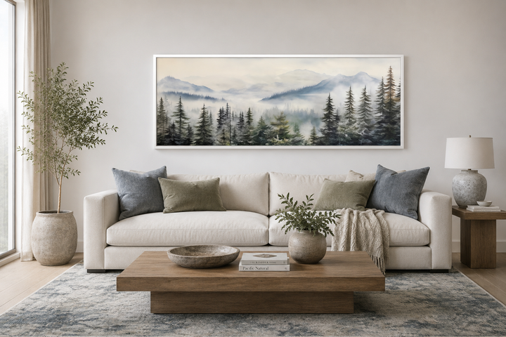 Foggy forest sage green long horizontal wall art in a white frame above a modern living room sofa.