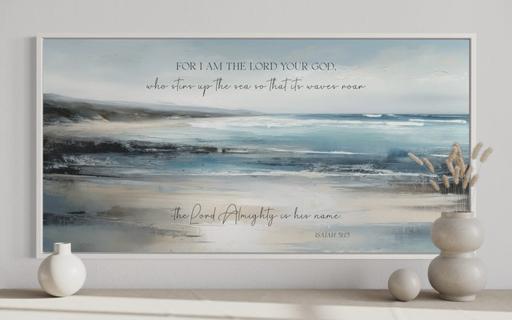 Coastal canvas wall art with Isaiah 51:15 scripture over a tranquil blue and gray ocean painting.