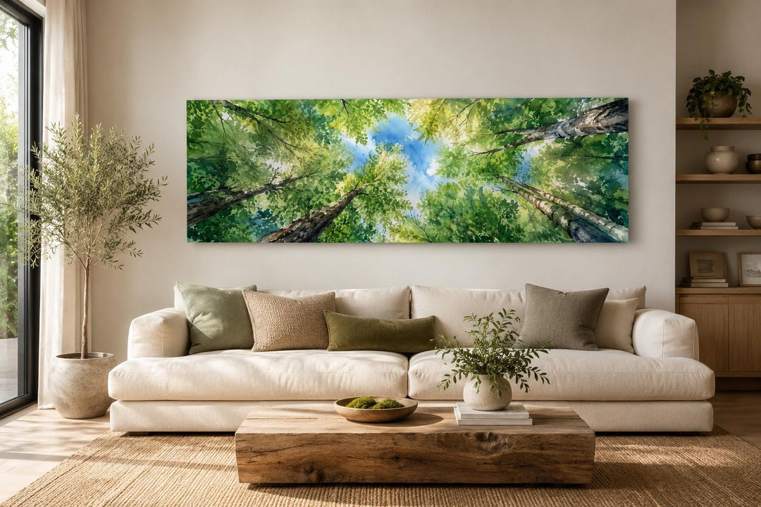 Panoramic forest canopy wall art above a white sofa in a modern farmhouse living room.