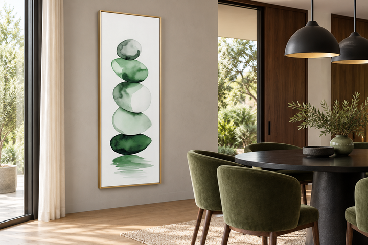 Tall narrow framed canvas wall art featuring stacked forest green and white watercolor rocks.