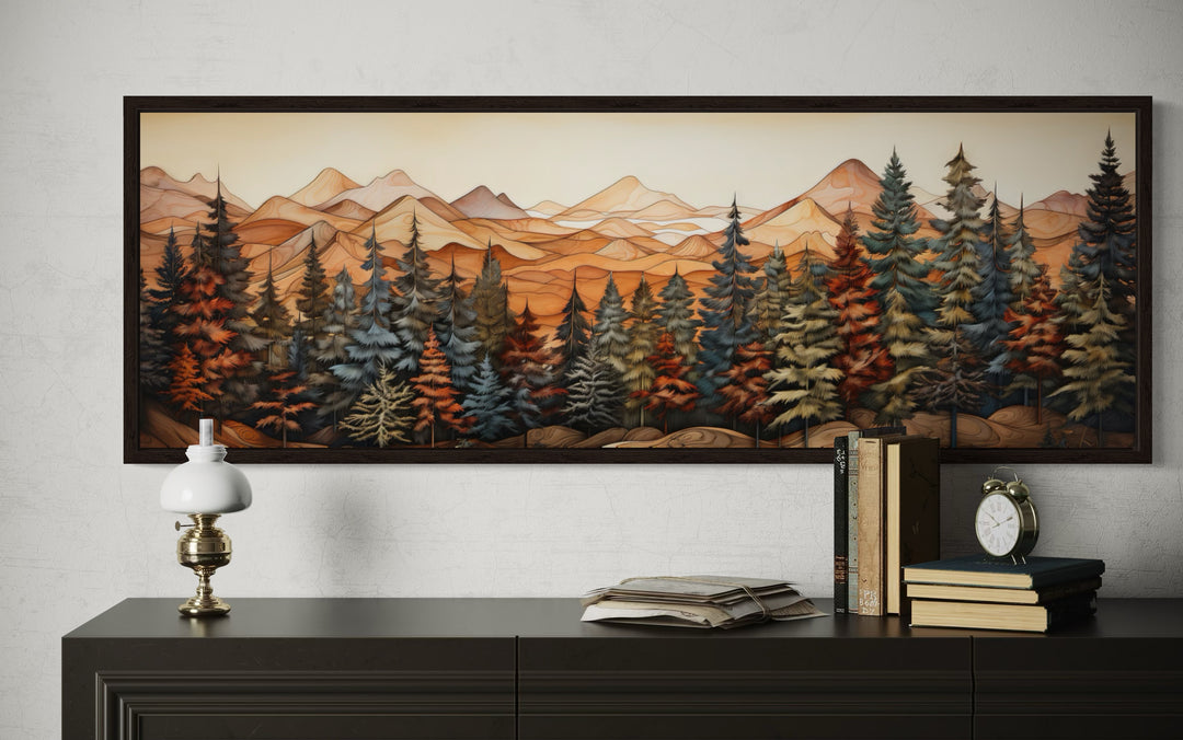 Panoramic rustic wall art of a forest and mountains on a wood-textured canvas above a dark console.
