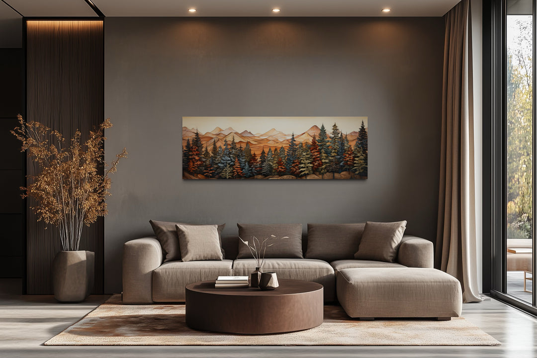 Long horizontal canvas wall art of a painted forest and mountains above a modern sofa.