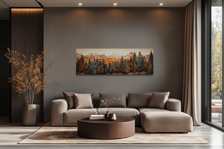 Long horizontal canvas wall art of a painted forest and mountains above a modern sofa.