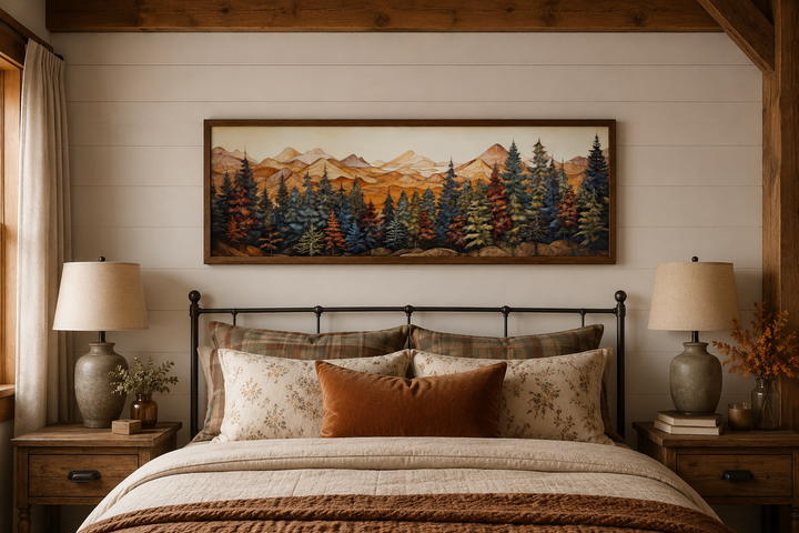 Panoramic forest and mountain painting on wood-textured canvas above a rustic bed.