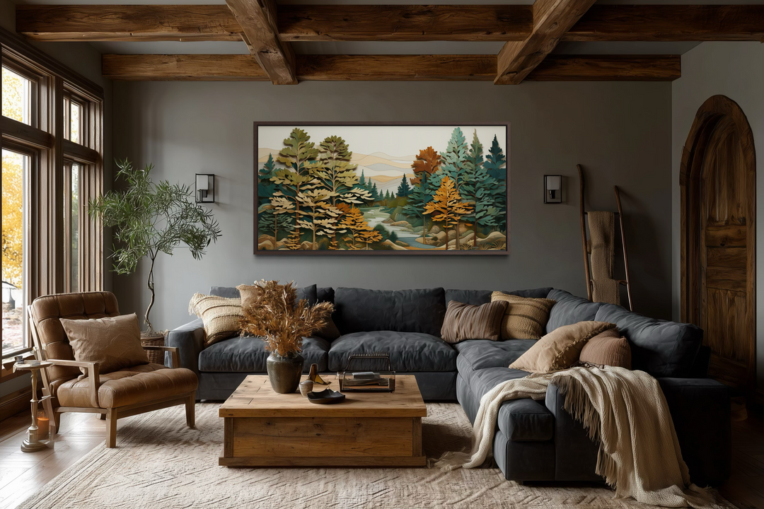 Layered wood forest river wall art in a rustic frame hanging above a dark gray sectional sofa.