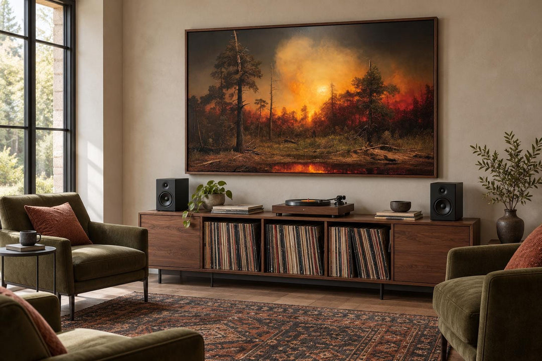 Framed canvas wall art of a forest wildfire with orange flames and smoke above a record player.