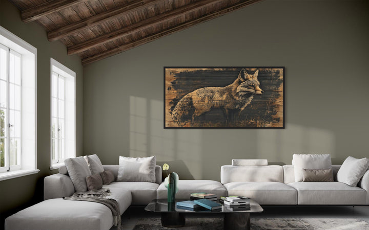 Framed canvas wall art featuring a fox painted on a dark wood background in a rustic living room.