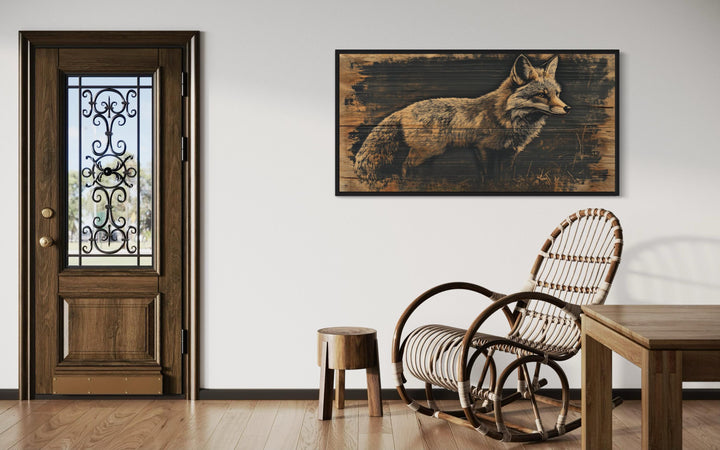 Fox painted on dark wood framed canvas wall art hanging in a rustic living room setting.