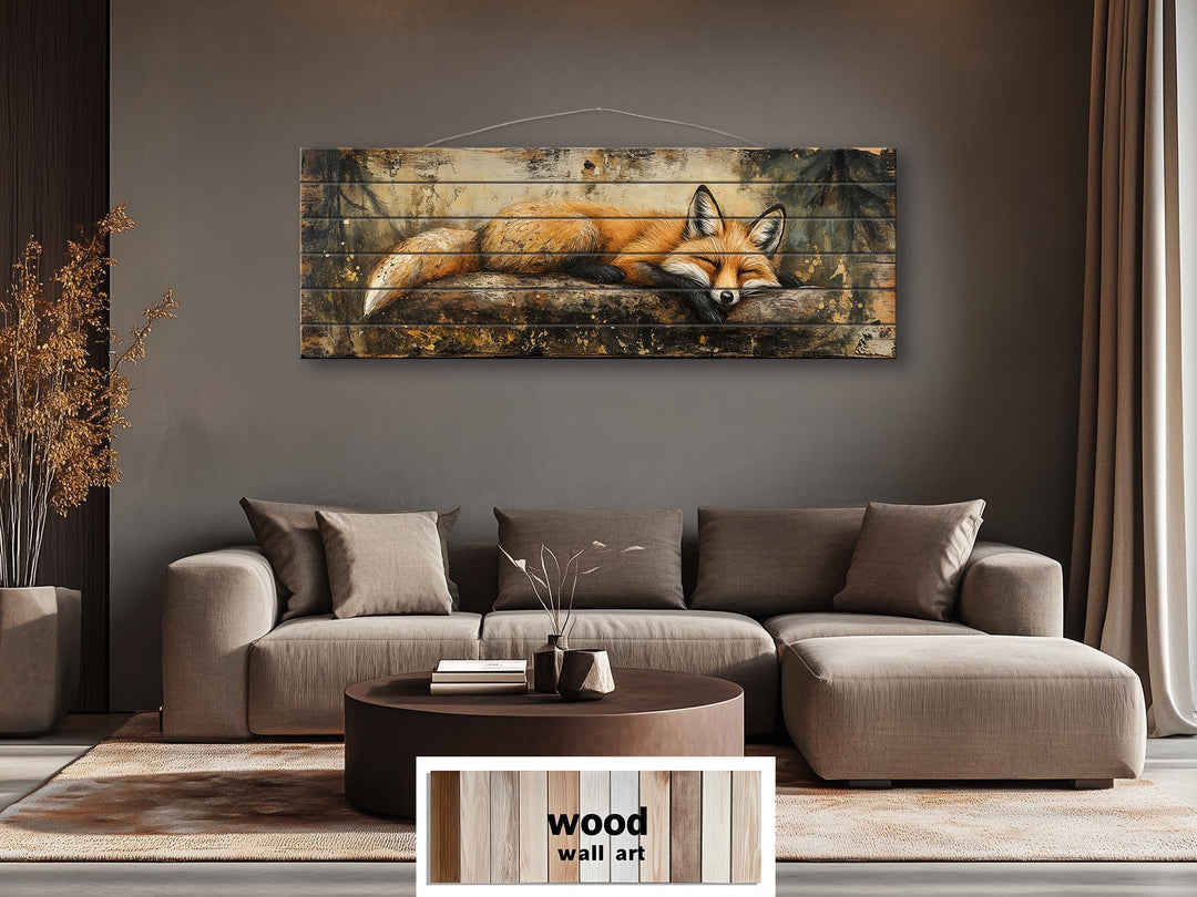 Rustic woodland wall art featuring a sleeping fox on a log printed on distressed wood planks.