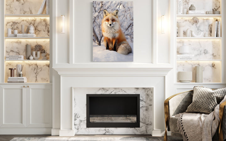 Framed canvas wall art of a red fox sitting in a snowy landscape above a white fireplace.