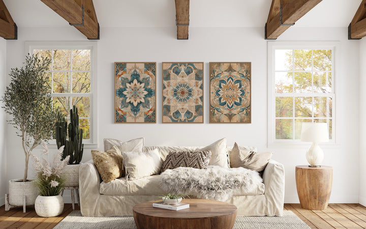 Framed wall art set of 3 boho neutral mandala prints hanging above a cream sofa in a living room.