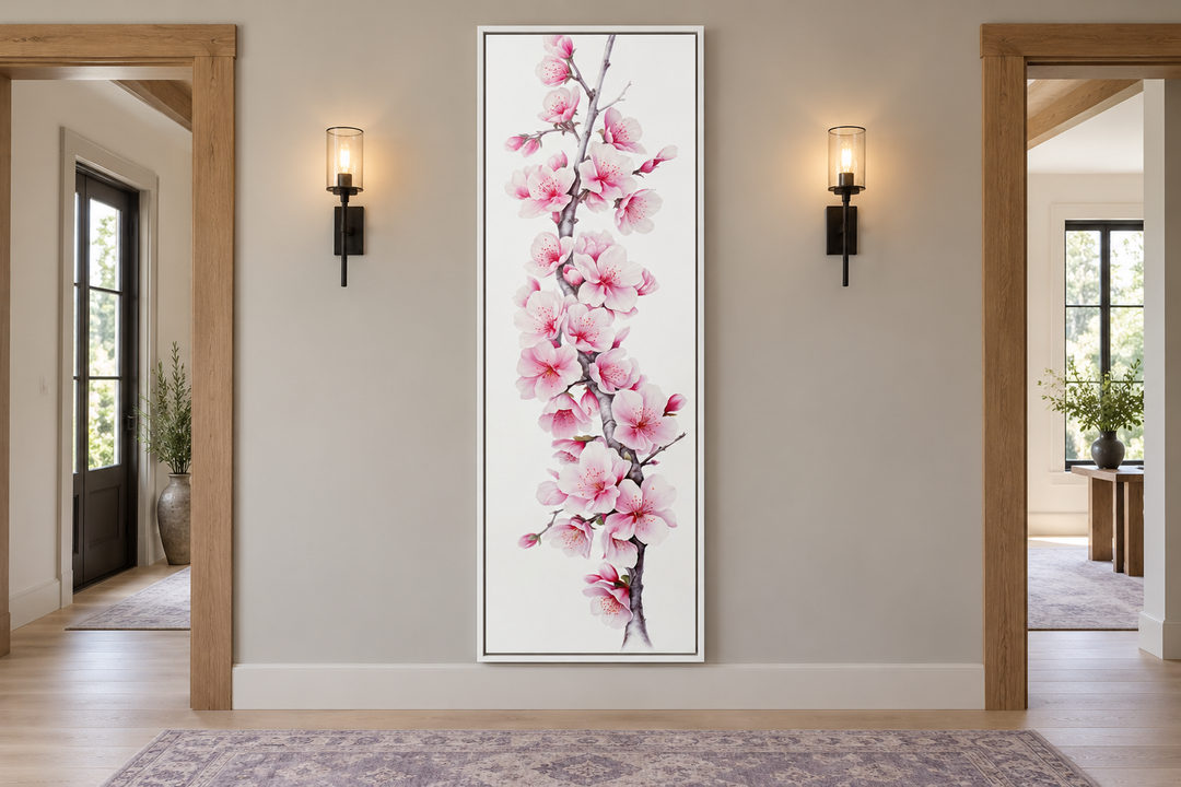 Vertical framed canvas wall art featuring pink watercolor cherry blossoms in a modern hallway.