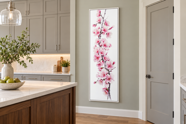 Long narrow vertical framed canvas wall art featuring pink watercolor cherry blossoms in a kitchen.