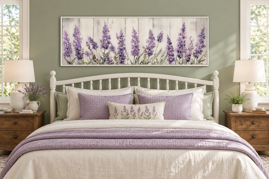 Purple lavender wildflowers framed canvas wall art hanging above a bed in a sage green bedroom.