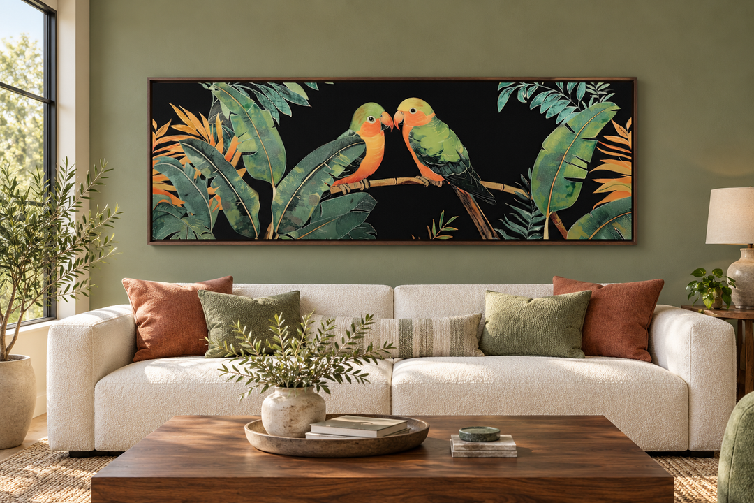 Lovebirds in tropical rainforest long horizontal framed canvas wall art above a white sofa.