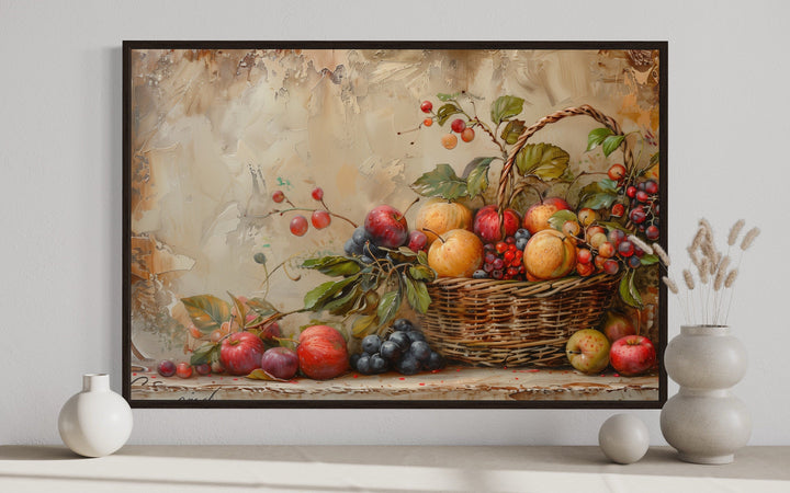 Framed rustic farmhouse wall art of a fruit basket with apples and grapes on a textured background.
