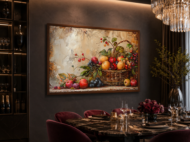 Framed rustic fruit basket painting on a dark wall above a set dining table in a modern room.