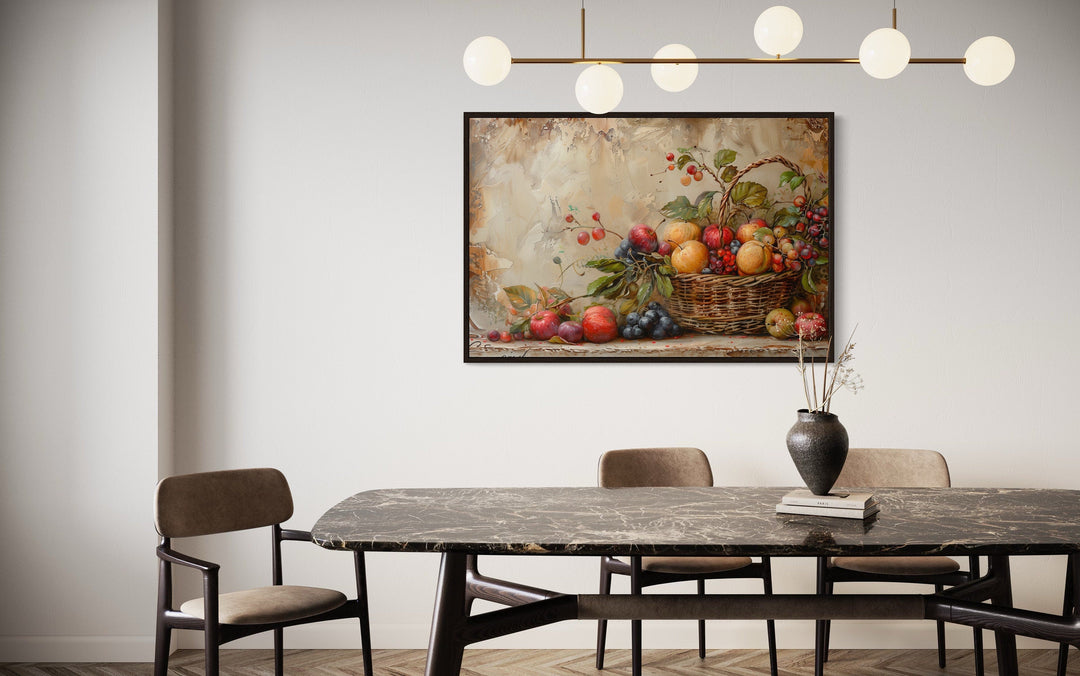 Framed rustic farmhouse wall art of a fruit basket above a marble dining table with chairs.