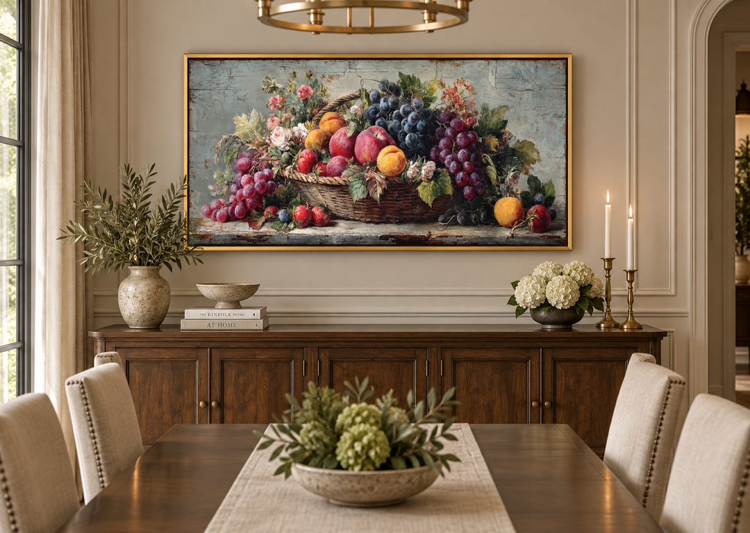 Rustic fruit still life canvas print with grapes, peaches, and apples in a basket over a sideboard.