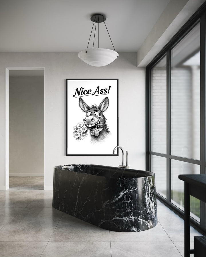 A framed black and white canvas print of a funny donkey with the text Nice Ass in a modern bathroom.
