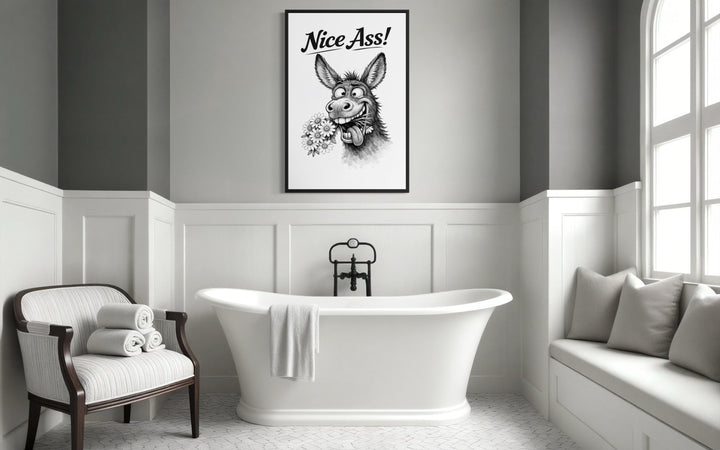 Funny donkey wall art with Nice Ass text in a black frame above a white bathtub.
