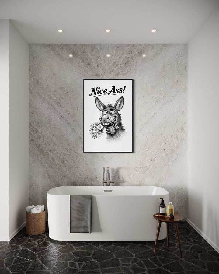 A framed black and white canvas print of a funny donkey with the text Nice Ass in a bathroom.
