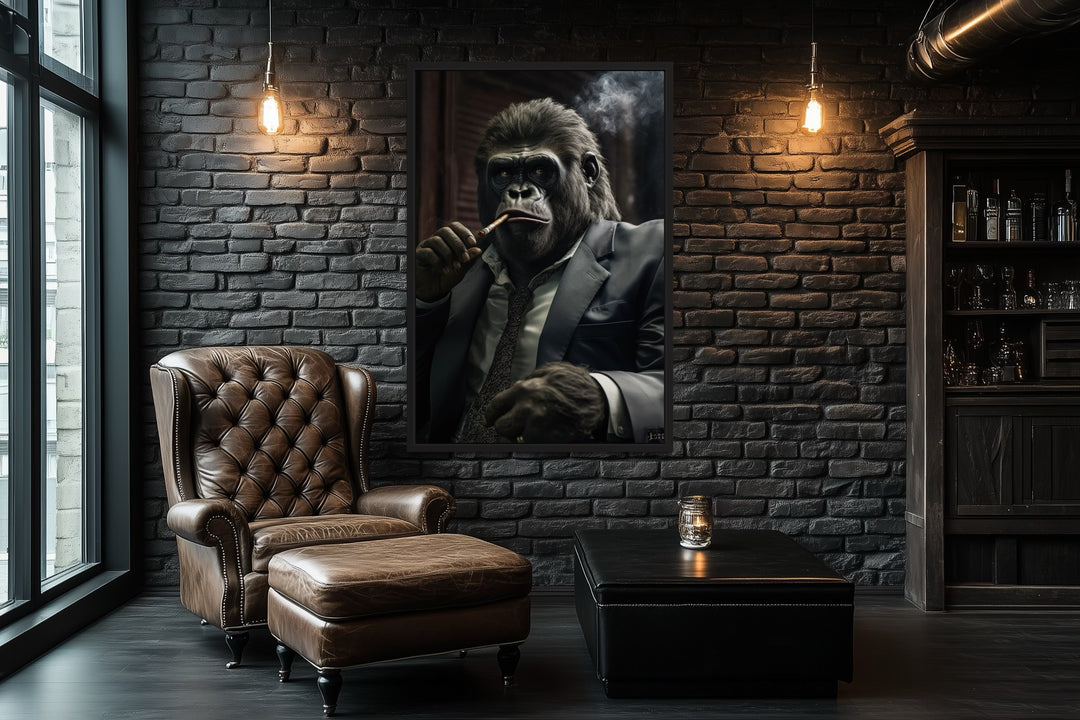 Framed canvas wall art of a gorilla in a suit smoking a cigar, hung in a dark brick office.