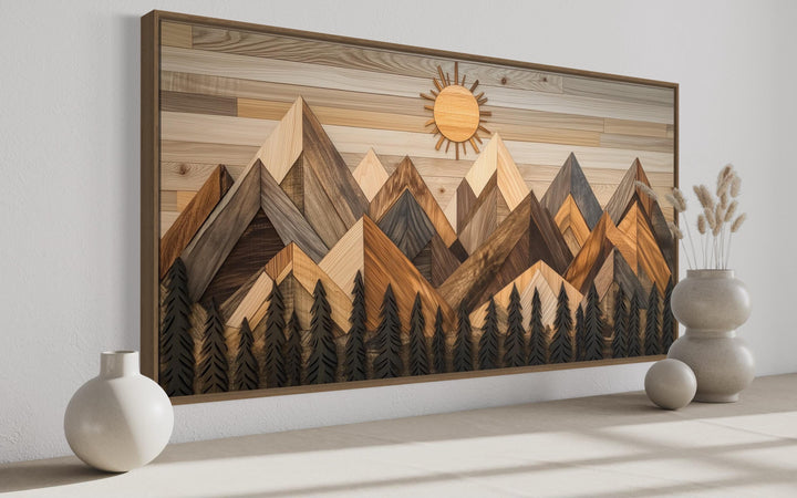 Geometric wood mountain and pine tree forest canvas wall art with a sun and earthy wood textures.