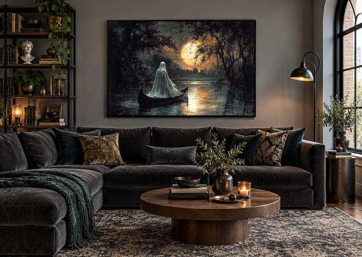 Gothic Halloween wall art of a white ghost in a canoe on a moonlit lake above a dark velvet sofa.