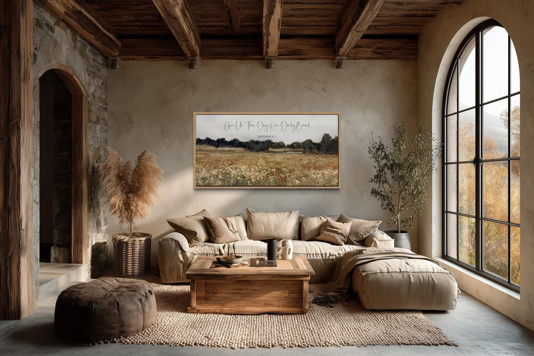 Horizontal scripture wall art featuring a rustic wildflower field in a cozy, earth-toned living room.