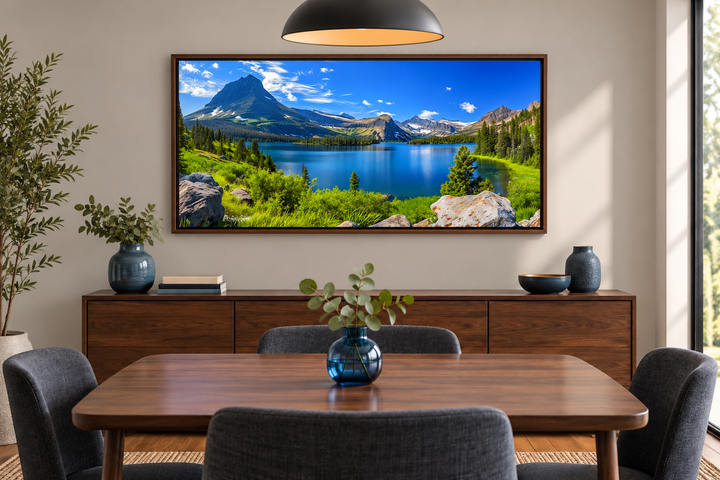 Framed canvas print of Glacier National Park landscape featuring a lake and mountains in a room.
