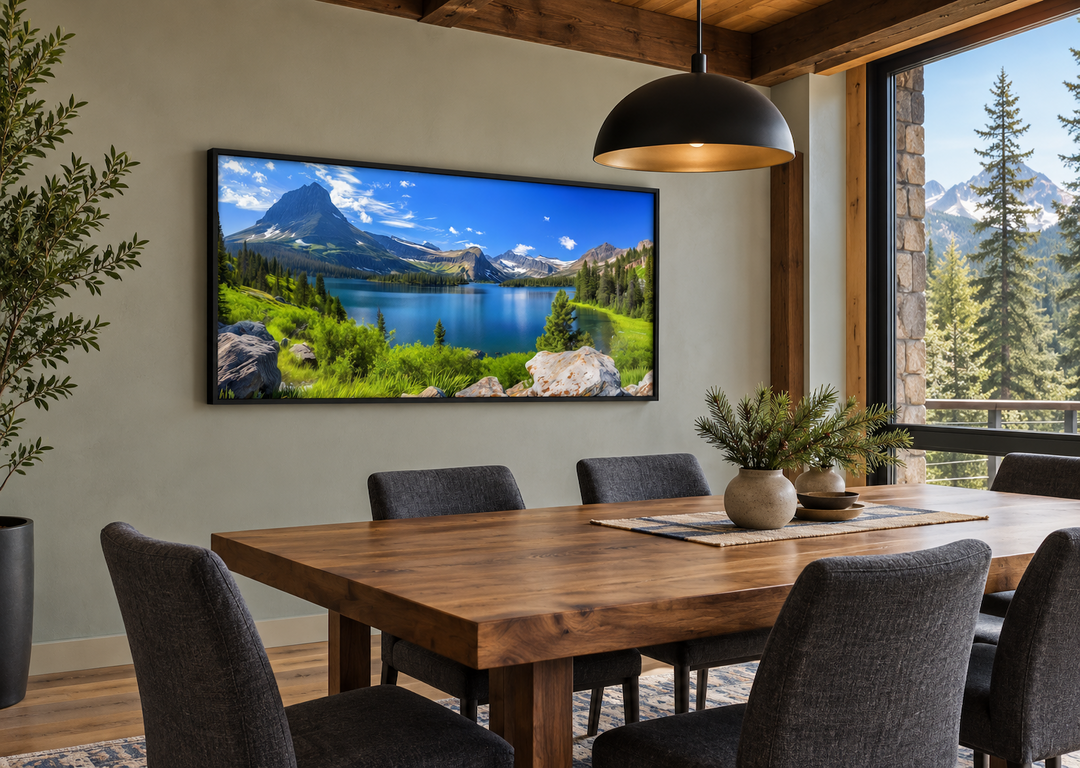 Framed canvas print of a Glacier National Park landscape hanging in a rustic dining room.