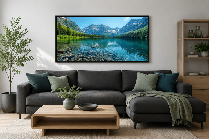 Glacier National Park framed canvas wall art above a dark grey sofa in a modern living room.