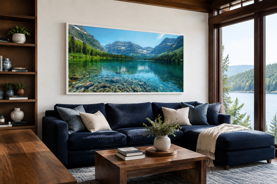 Framed canvas wall art of Glacier National Park landscape above a navy sofa in a rustic living room.