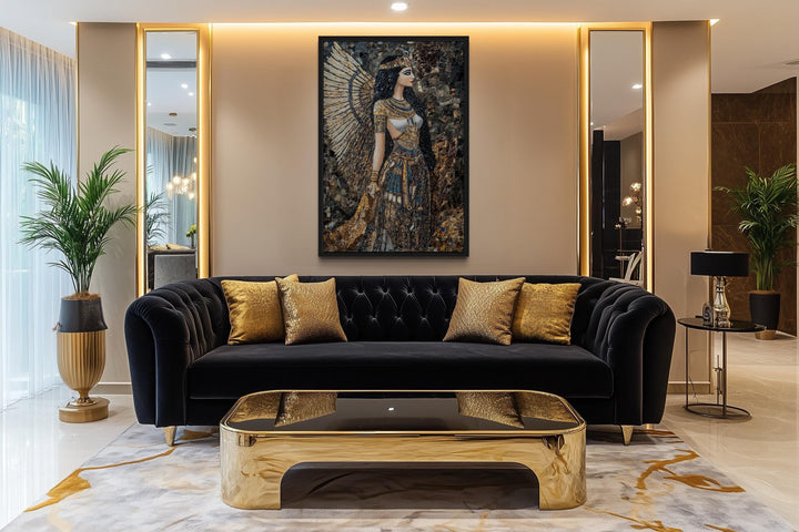 Goddess Isis mosaic-style framed canvas wall art hanging above a black sofa in a modern living room.