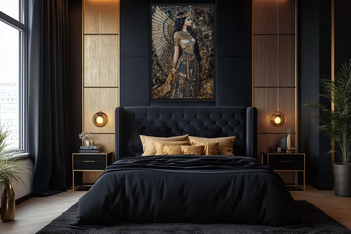 Goddess Isis mosaic-style framed canvas wall art hanging above a black tufted bed in a bedroom.