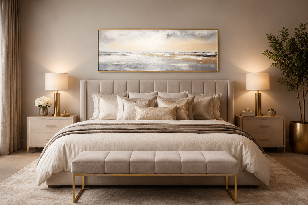 Gold and silver abstract beach sunset minimalist panoramic wall art hanging over a bed.