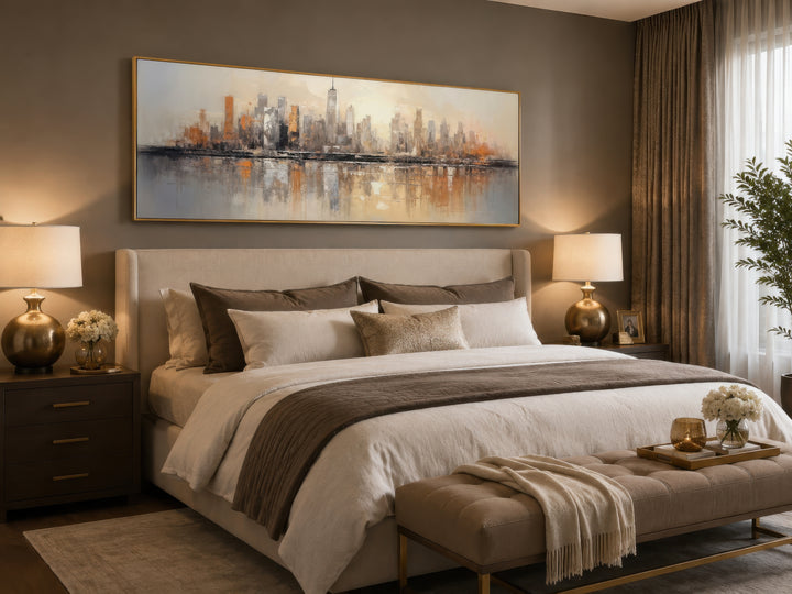 Gold and silver abstract New York City skyline horizontal wall art hanging above a bed.