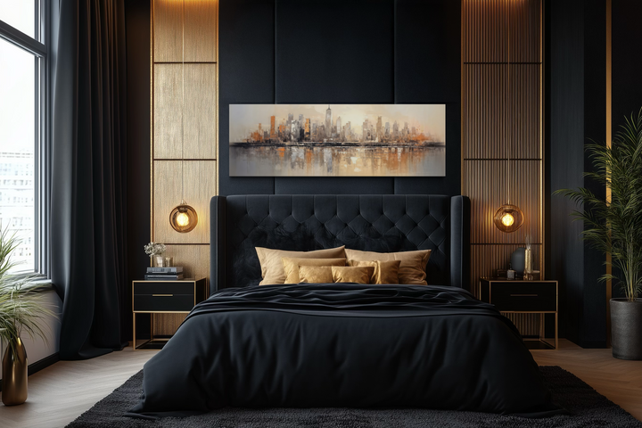 Horizontal abstract New York City skyline wall art in gold and silver tones above a black bed.
