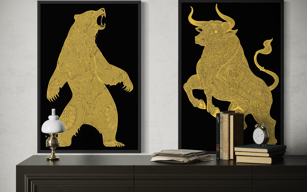Two black and gold canvas prints of a bear and a bull with intricate gold line art on a dark dresser.