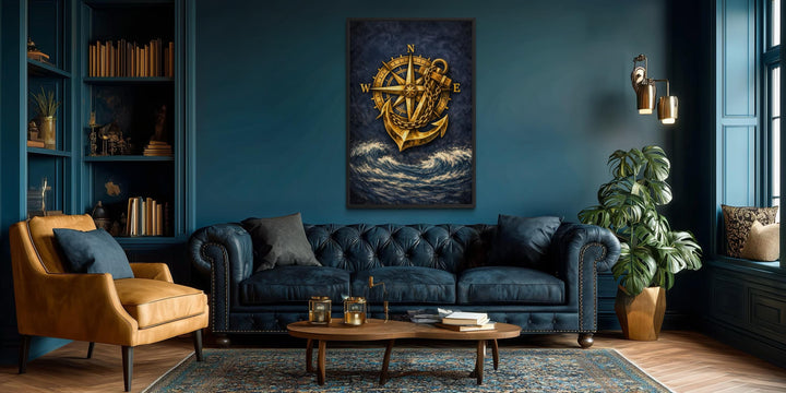 Gold compass and anchor canvas wall art centered on a navy blue wall in a modern nautical room.