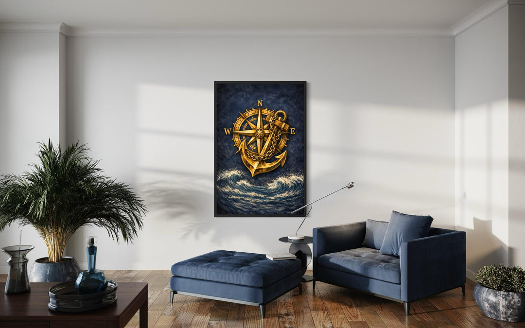 Nautical wall art featuring a gold compass and anchor over navy blue ocean waves in a modern room.