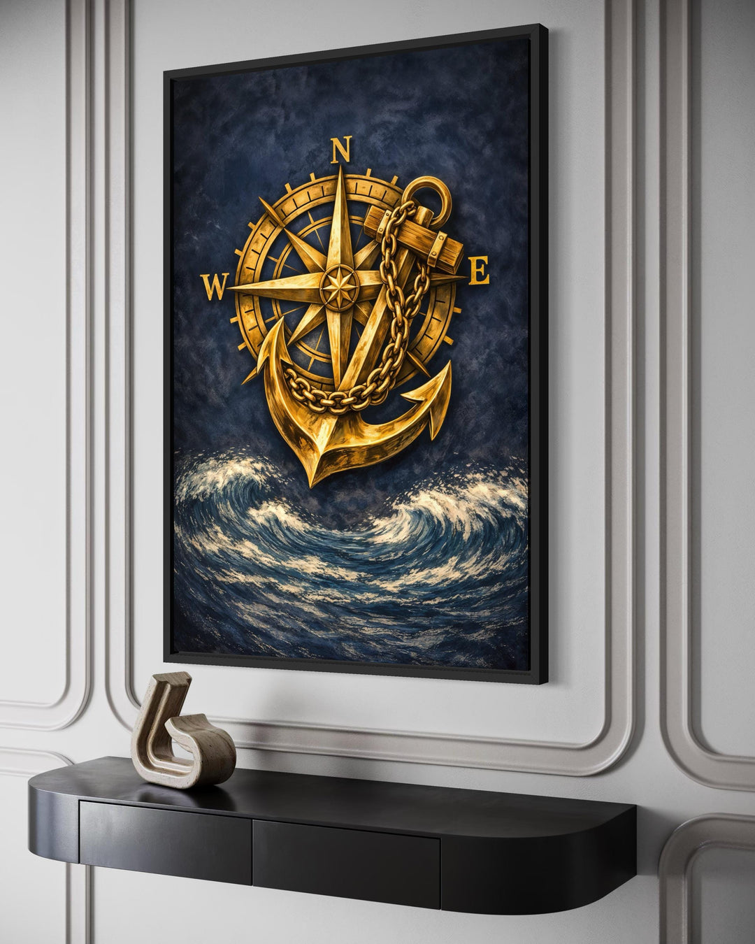 Nautical wall art featuring a gold compass and anchor over dark navy blue ocean waves.