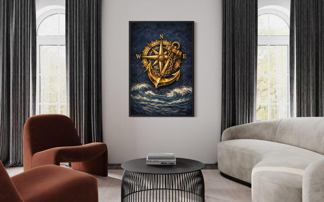 Gold compass and anchor canvas wall art on a navy blue ocean background in a modern living room.
