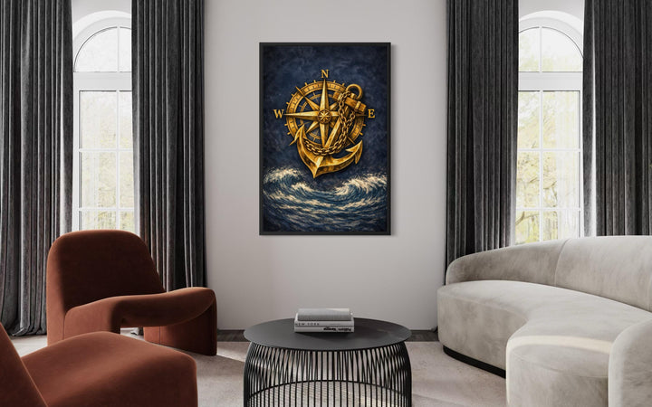 Gold compass and anchor canvas wall art on a navy blue ocean background in a modern living room.