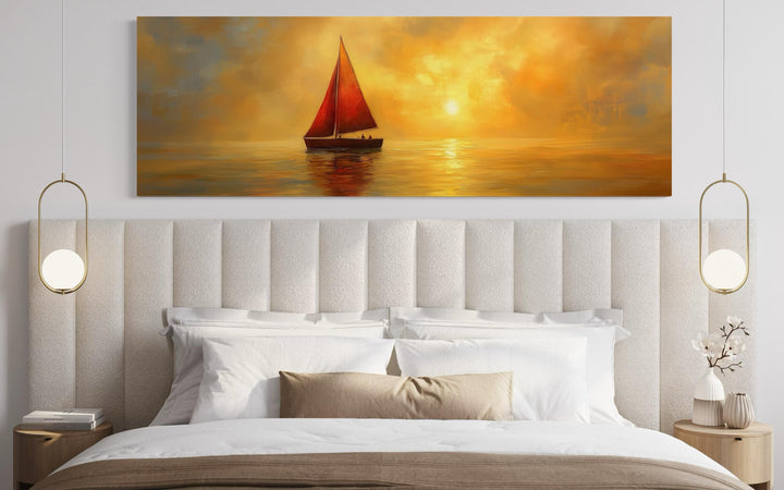 Gold Red Sail Boat Long Narrow Framed Canvas Wall Art hanging above a bed in a modern bedroom.