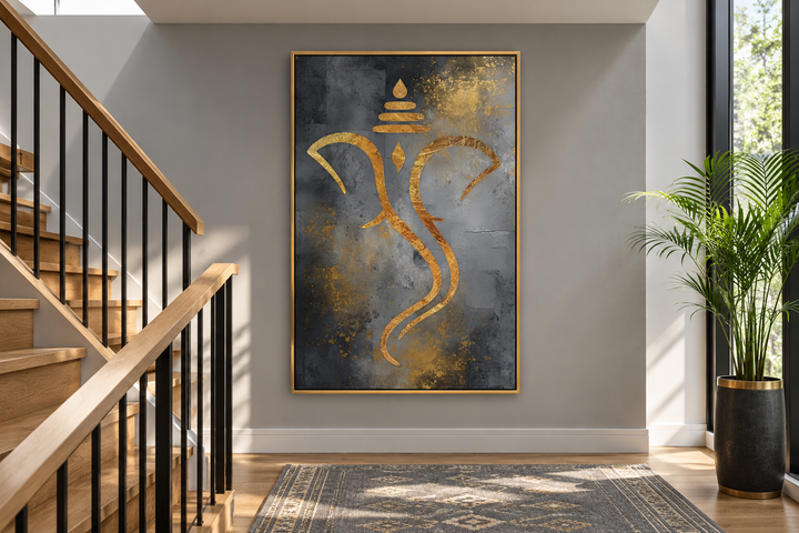 Grey and gold minimalist Lord Ganesha framed canvas wall art hanging on a grey wall near a staircase.